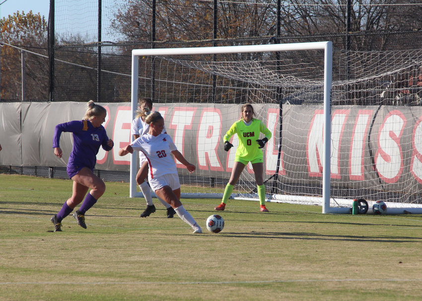 Central Missouri freshman Caroline Cole kicks the ball away from her team's net late in the NCAA Division II Central Region semifinal on Sunday, Nov. 21, at the UCM South Recreation Complex.