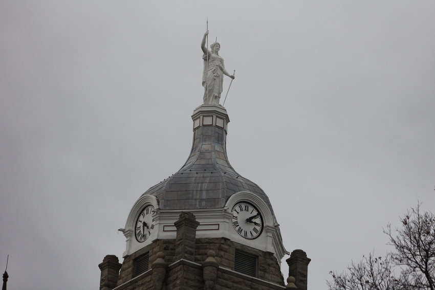 The four faces of the Johnson County Courthouse clock tower are currently 15 years old.