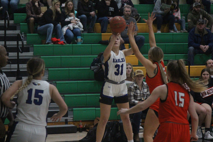 Holden junior Marah Klover puts up a shot against Knob Noster in the first round of the Quarry City Cougar Classic on Monday, Jan. 24, at Crest Ridge High School.