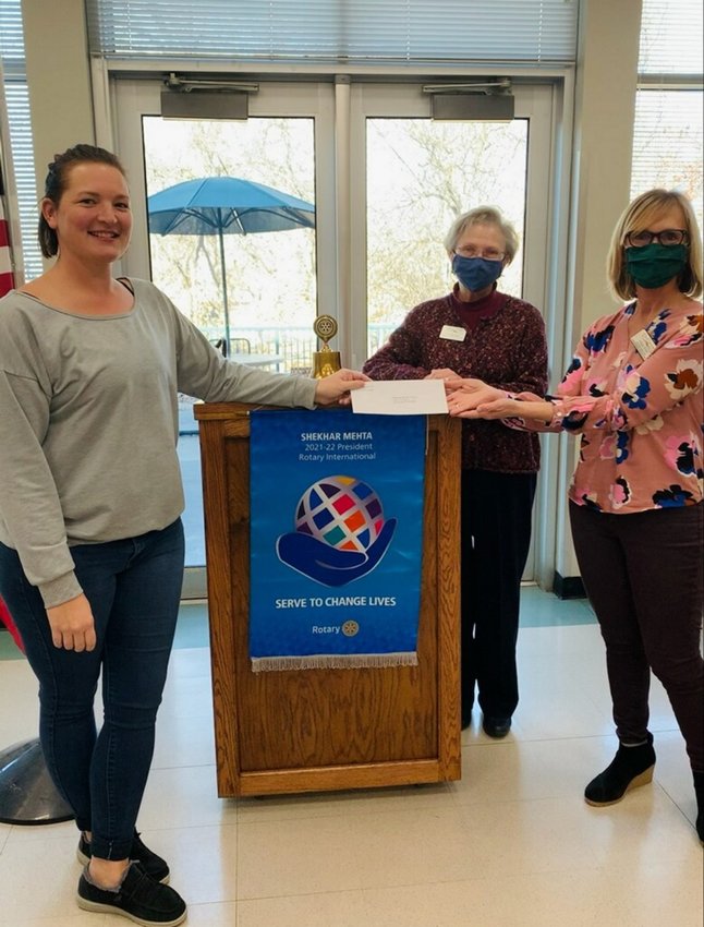 Rotary Club of Warrensburg President Allison Bolt presents a check to the Meals on Wheels program coordinated through the Senior Center and Care Connection. From left, Bolt, Center Coordinator Ellen Friel and Deb Krieger.