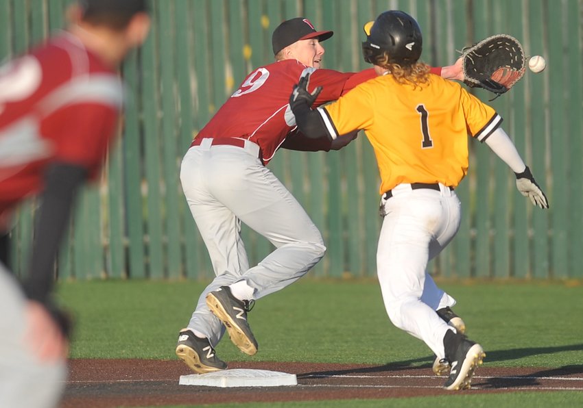 A throw to Warrensburg&rsquo;s Gage Claunch beats the runner at first base for an out late in Monday&rsquo;s game against Smith-Cotton.