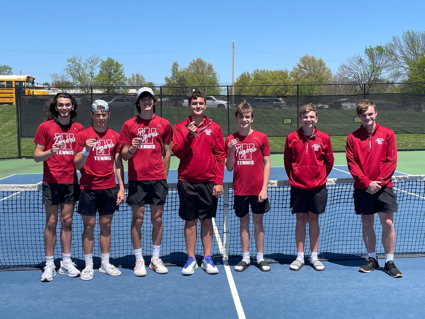 Warrensburg boys tennis poses for a photo following individual districts on Saturday, May 7, in Marshall.