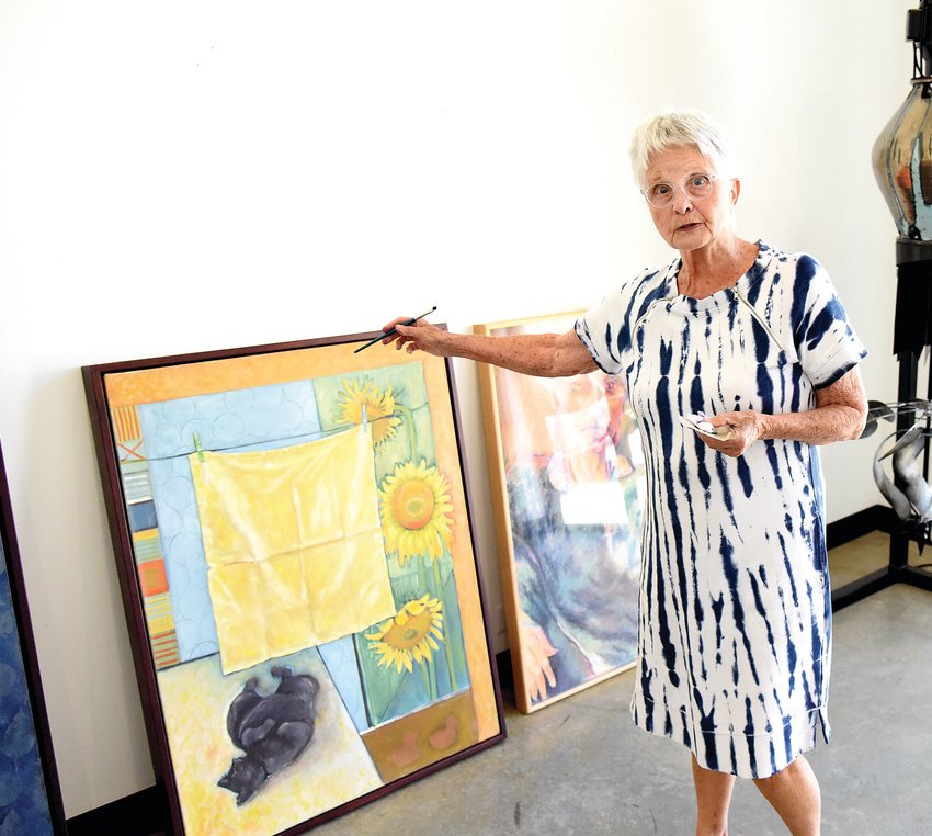On Monday, artist Neva Wood, of Jefferson City, talks about one of her paintings that is part of her exhibit featuring women at the Hayden Liberty Center. The opening reception is from 5 to 7 p.m. Friday, May 20, at the Center, 111 W. Fifth St. It is free and open to the public.