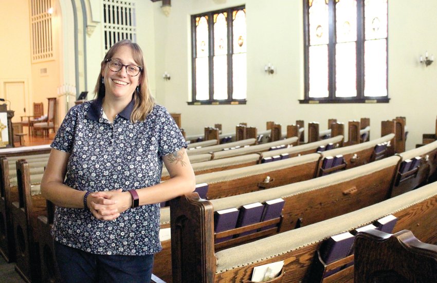 Pastor Heather Jepsen stands in the First Presbyterian Church sanctuary on Monday morning. This weekend, the congregation is celebrating Jepsen&rsquo;s 10-year anniversary with the church.
