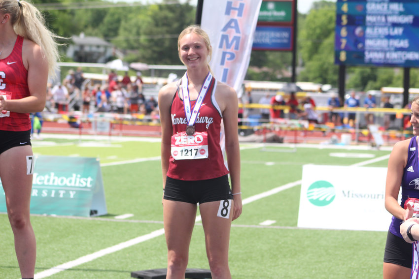 Warrensburg junior Grace Hill poses for a photo after placing fourth in the MSHSAA Class 4 Championships 100 meter hurdles finals Saturday, May 28, at Adkins Stadium.