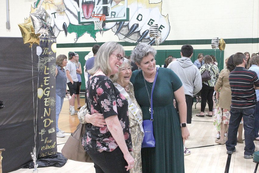 Juanita Peaslee meets with former students during her retirement celebration Sunday, June 5, in the Crest Ridge gym.