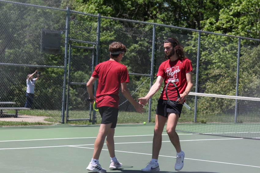 Warrensburg senior Jack Renfrow and junior Sam Renfrow celebrate a point against Savannah during the Class 1 quarterfinal round Monday, May 16, in INdependence.
