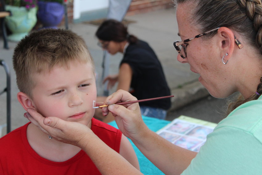 Eustace gets his face painted at the Knob Noster Fair on Saturday. He came with his family to enjoy the festivities. The Knob Noster Fair was hosted June 9-11 in downtown Knob  Noster.