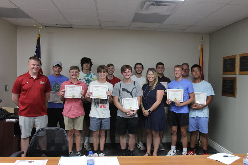 The Warrensburg School Board of Education recognizes members of the boys tennis team as state champions at the Tuesday, June 14, meeting.