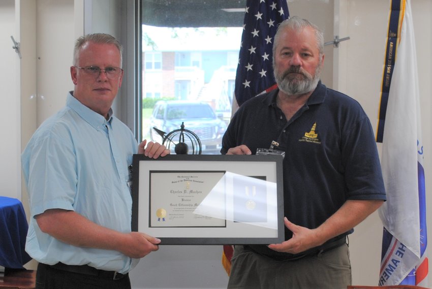Director of the Museum of Missouri Military History Charles Machon is presented with the SAR Bronze Good Citizenship Medal and Certificate by Doug Christie at the Saturday, June 18, regular meeting of the Martin Warren Chapter, Missouri Society, Sons of the American Revolution.