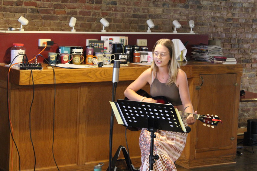 Lydia Joy performs one of her original songs at the Old Drum open mic night on July 7 at Java Junction. Joy&rsquo;s acoustic style songs can be heard regularly at the Old Drum open mic nights.