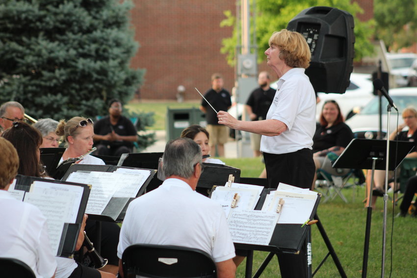 Pat Setser conducts the Warrensburg Community Band concert July 11 on the Johnson County Courthouse lawn. Setser has been a music director in Missouri for 37 years and is about to begin her 11th year at the University of Central Missouri.