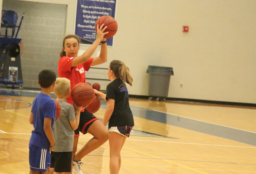 Olivia Nelson instructs youth athletes during a skills camp Tuesday, July 12, at LIberty High School.