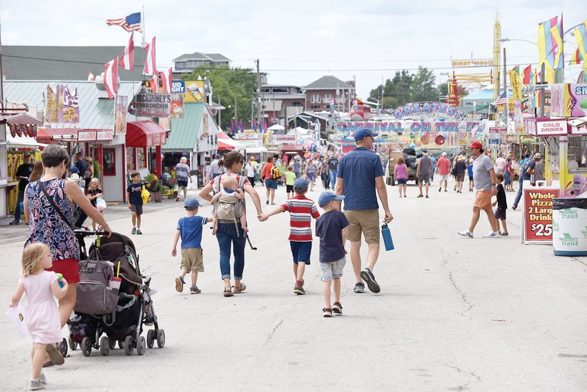 The main thoroughfare at the Missouri State Fair is busy Friday, Aug. 13, 2021. The 120th Missouri State Fair will offer &ldquo;Buckets of Fun&rdquo; this year with new contests and free events.