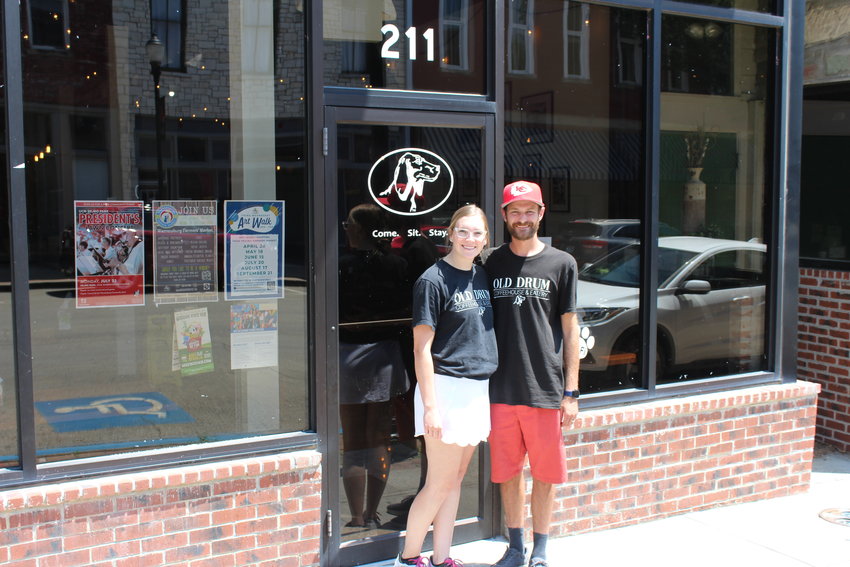 Dane and Bailey Ross pose for a photo in front of their new business, Old Drum Coffeehouse and Eatery. The couple recently purchased the business at 211 N. Holden St. in hopes of continuing a Warrensburg tradition.