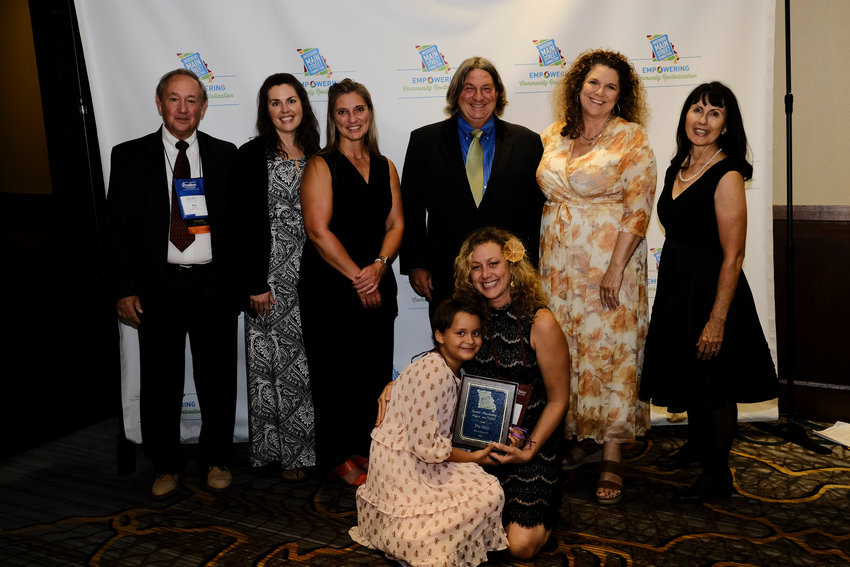 Representatives from Warrensburg Main Street and the City of Warrensburg pose for a photo with their award at Missouri&rsquo;s Premier Downtown Revitalization Conference in Kansas City on Aug. 5.
