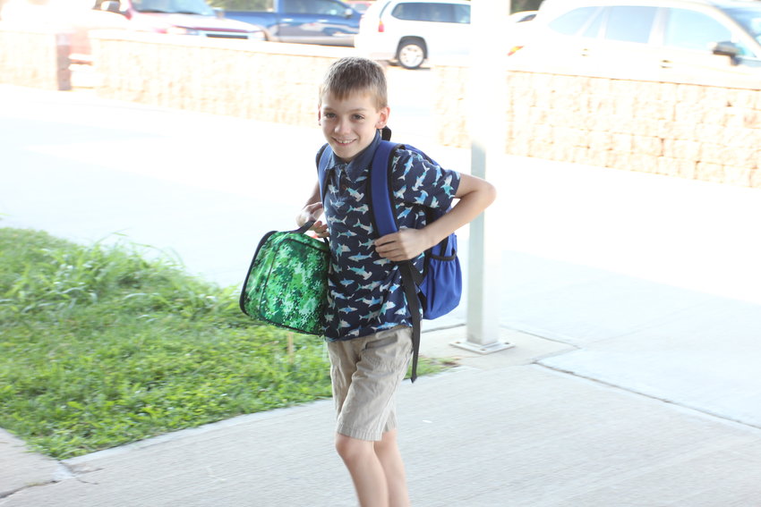 Braden Schroeder wears a shark-themed shirt for the first day of school Wednesday, Aug. 24, at Sterling Elementary School.