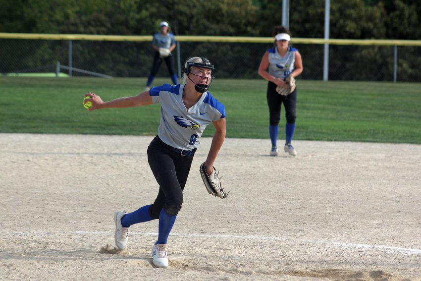 Holden freshman Jazmyn Brown winds a pitch against Pleasant Hill in the GKC Tournament Bronze Bracket championship Saturday, Aug. 27, at Adair Park in Independence.