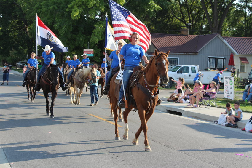 The Holden Saddle Club wraps up the end of the parade during the Holden Street Fair on Saturday. The club does trail rides and has a show every month.
