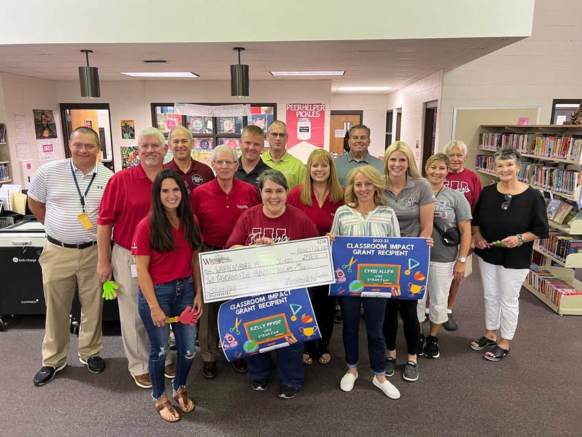 Warrensburg Schools Foundation board members award the Stephen and Kristi Westhead Classroom Impact Grant to Cyndi Allen and Kelly Pryde for STEAM Fair on Friday, Aug. 26.