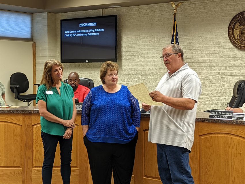 Mayor Jim Kushner reads a proclamation recognizing the work of West-Central Independent Living Solutions during the Warrensburg City Council meeting Monday, Sept. 12.