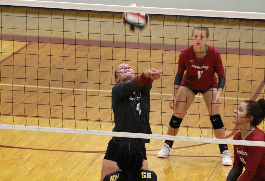 Warrensburg libero Elise Lewis passes the ball against Grandview on Monday, Sept. 19, at Warrensburg High School.