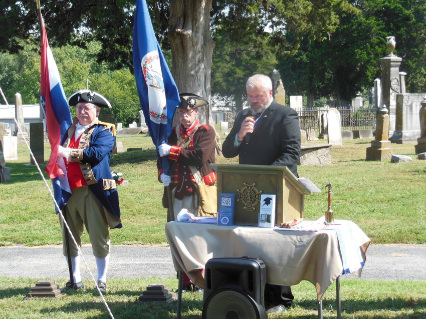 From left, Don Turner, Ozark Patriots Chapter; Stephen Sullins, Independence Patriots Chapter; and Doug Christie, President of the Martin Warren Chapter, participate in a grave marking ceremony hosted by the Missouri Society Sons of the American Revolution.