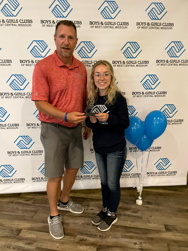 BGC Executive Director Gary Beckman presents Kaitlyn Wilcox with a Gold Distinguished Club Award for the Leeton Site. Wilcox was previously a Youth Development Professional at the Leeton Site and now serves as the Green Ridge Site Program Director.