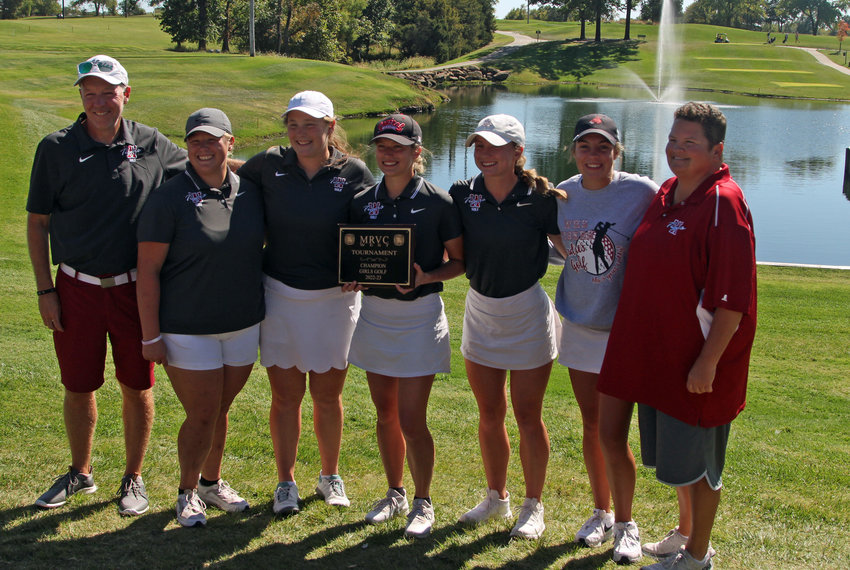 Warrensburg girls golf poses for a team photo with its MRVC Tournament plaque on Monday, Oct. 3, at Mules National Golf Club.