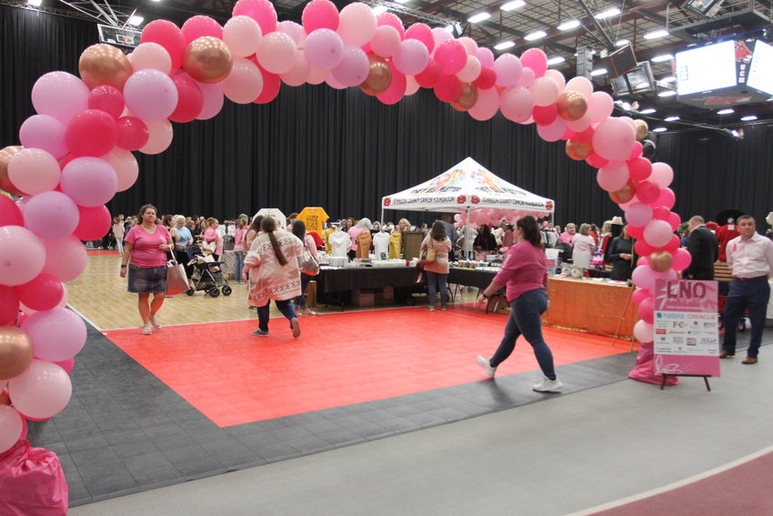 A pink arch welcomes event-goers to the 2022 Ladies Night Out hosted by Western Missouri Medical Center on Oct. 8 at the Multipurpose Building.