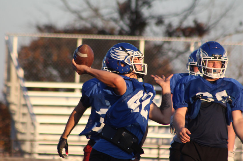 Holden junior quarterback Aiden Morarity throws a pass during practice Tuesday, Nov. 1, at Holden High School.