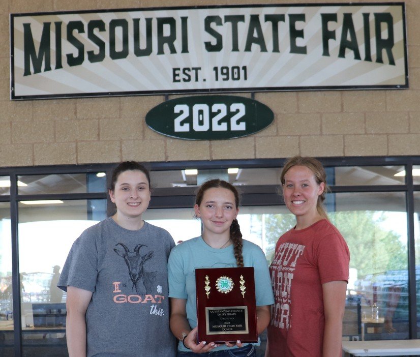 From left displaying their award are Riley Edmunds, daughter of Rocky and Rhonda Edmunds of Warrensburg; Grayci Holcomb, daughter of Tom and Kristen Holcomb of Odessa; and Marlys Kanneman, daughter of Arthur and Kathrine Kanneman of Warrensburg.