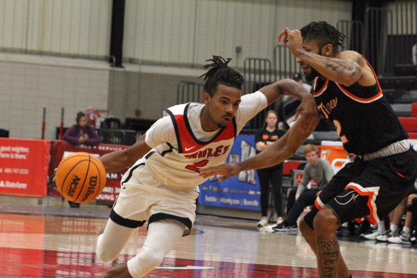 Central Missouri redshirt sophomore Mikel Henderson drives the ball into the paint against East Central on Sunday, Nov. 13, at the UCM Multipurpose Building.