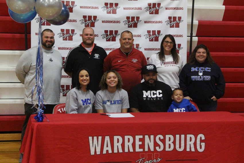 Warrensburg senior Nadyia Mundy signed her letter of intent to play softball at Metropolitan Community College on Thursday, Nov. 17, at Warrensburg High School.