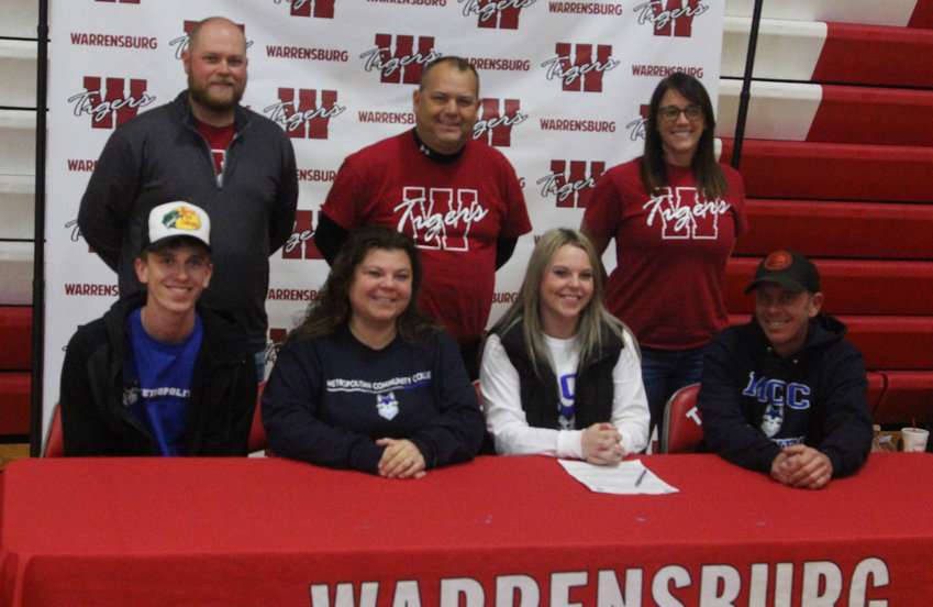Payton Smith signed her letter to play softball at Metropolitan Community College on Friday, Nov. 18, at Warrensburg High School.