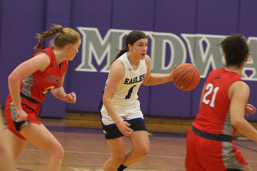 Holden freshman Adalyn Campbell dribbles the ball against Sherwood on Saturday, Dec. 17, at Midway High School.