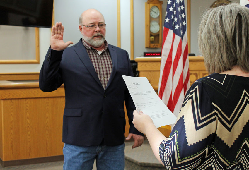 Johnson County Presiding Commissioner-Elect Troy Matthews is sworn in by County Clerk Diane Thompson on Wednesday morning, Dec. 28 at the Johnson County Justice Center. Matthews won a crowded Republican primary in August and was elected in the November general election.