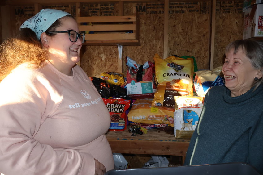 Esther Stevens and Old Drum Director Bobbi Yeo share a laugh while looking through the donated animal supplies at Old Drum Animal Shelter on Thursday, Feb. 2.&nbsp;
