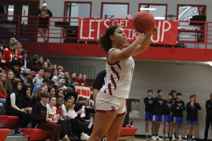 Warrensburg sophomore Maleah Myers attempts a three-point shot against Harrisonville on Friday, Feb. 3, at Warrensburg High School.