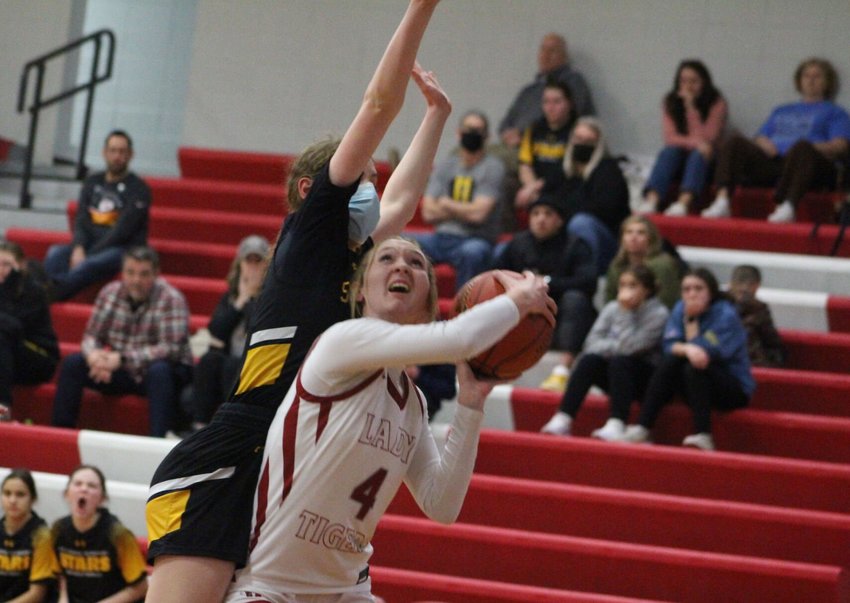 Warrensburg senior Grace Hill goes up for a shot against St. Teresa&rsquo;s Academy on Tuesday, Feb. 14, at Warrensburg High School.
