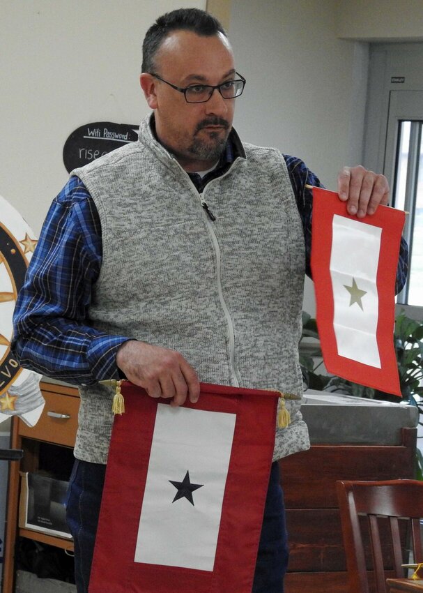 Author Jeremy Amick explains the Blue, Silver, and Gold Star designations to Daughters of the American Revolution at the organization&rsquo;s March 10 meeting.