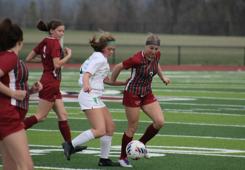 Warrensburg sophomore Gabby Fatka dribbles the ball against Blair Oaks on Tuesday, April 4, at the Warrensburg Activities Complex.
