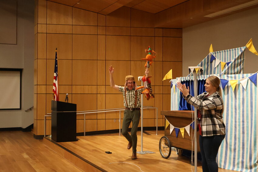Mike Horner and the wiener dogs perform their grand finale, which included all three dogs riding a unicycle on a tight rope, during&nbsp;&quot;Cirque du Wiener Dog,&quot; a performance by the What If? Puppet Theater on Thursday, April 6 at the University of Central Missouri.   &nbsp;