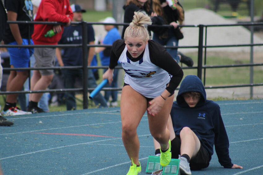 Holden senior Kimmie Spring takes off from the starting blocks in the 4x200 meter relay at the olden Blue and White Invitational on Friday, April 28, at Holden High School.
