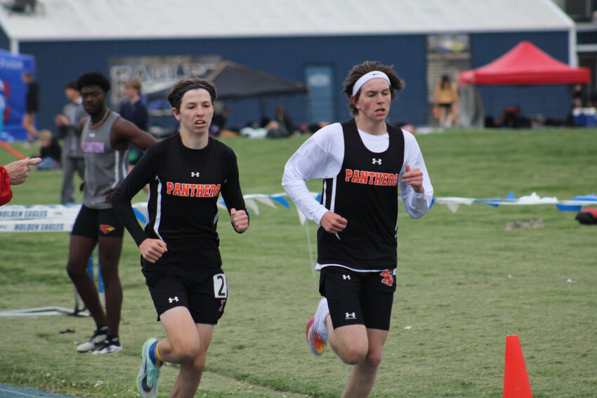 Knob Noster sophomore Hunter DeLeeuw and junior Tyler Zink run the 1600-meter run at the HOlden Eagle Blue and White Invitational on Friday, April 28, at Holden High School.