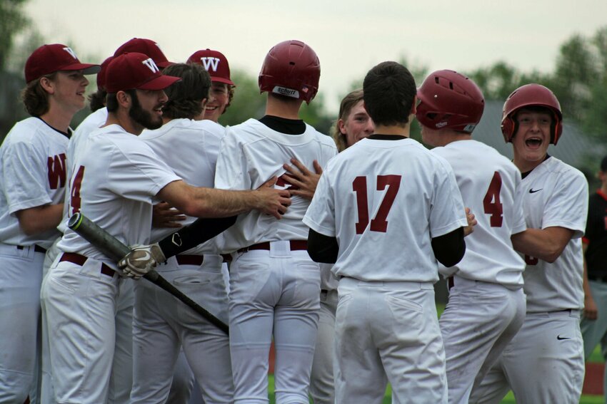 Warrensburg baseball celebrates a walkoff win against Oak Grove on Thursday, May 4, at the Warrensburg Activities Complex.