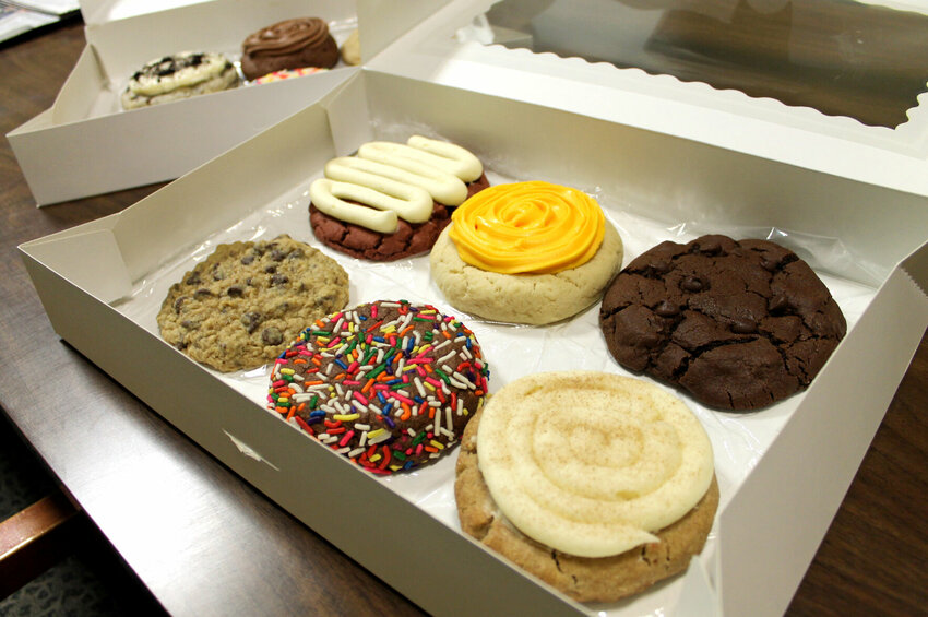 Cookie Cravings offers about 12 different flavors of cookies. Those pictured are red velvet, sugar cookie, chocolate chocolate chip, oatmeal chocolate chip, chocolate sugar cookie, and cinnamon roll.   Photo by Nicole Cooke | Star-Journal