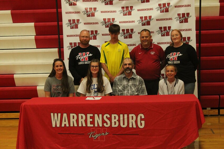 Warrensburg senior Ellie Wiederhoeft signed her letter of intent to play soccer at Metropolitan Community College during a ceremony Tuesday, May 9, at Warrensburg High School.