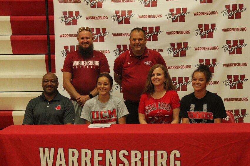 Warrensburg senior Kira Wyatt signed her letter of intent to compete for Jennies track and field during a ceremony Tuesday, May 9, at Warrensburg High School.