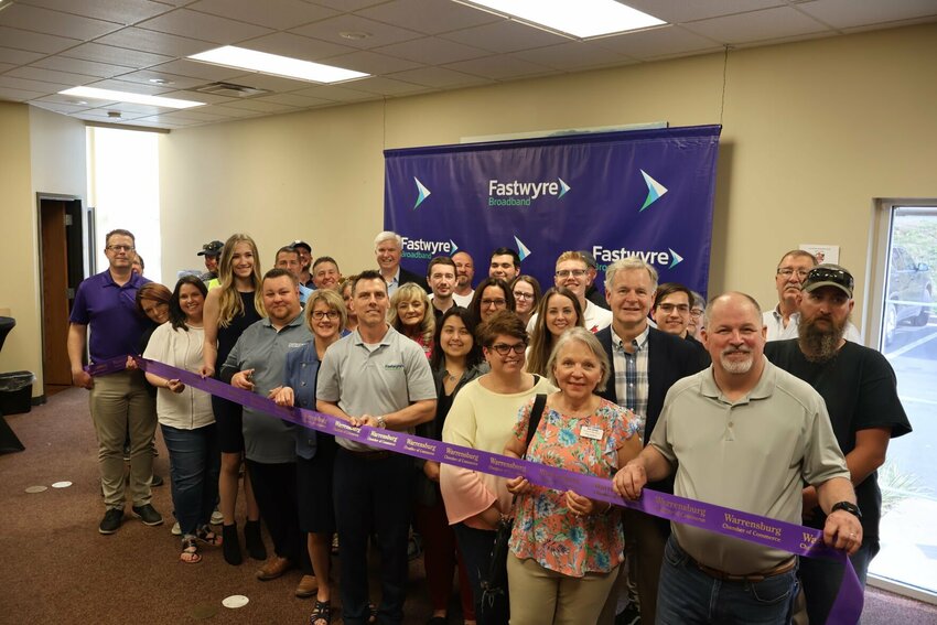 Local and state officials, Fastwyre representatives and Warrensburg Chamber of Commerce members pose for a photo during the Fastwyre ribbon cutting on Wednesday, May 17.